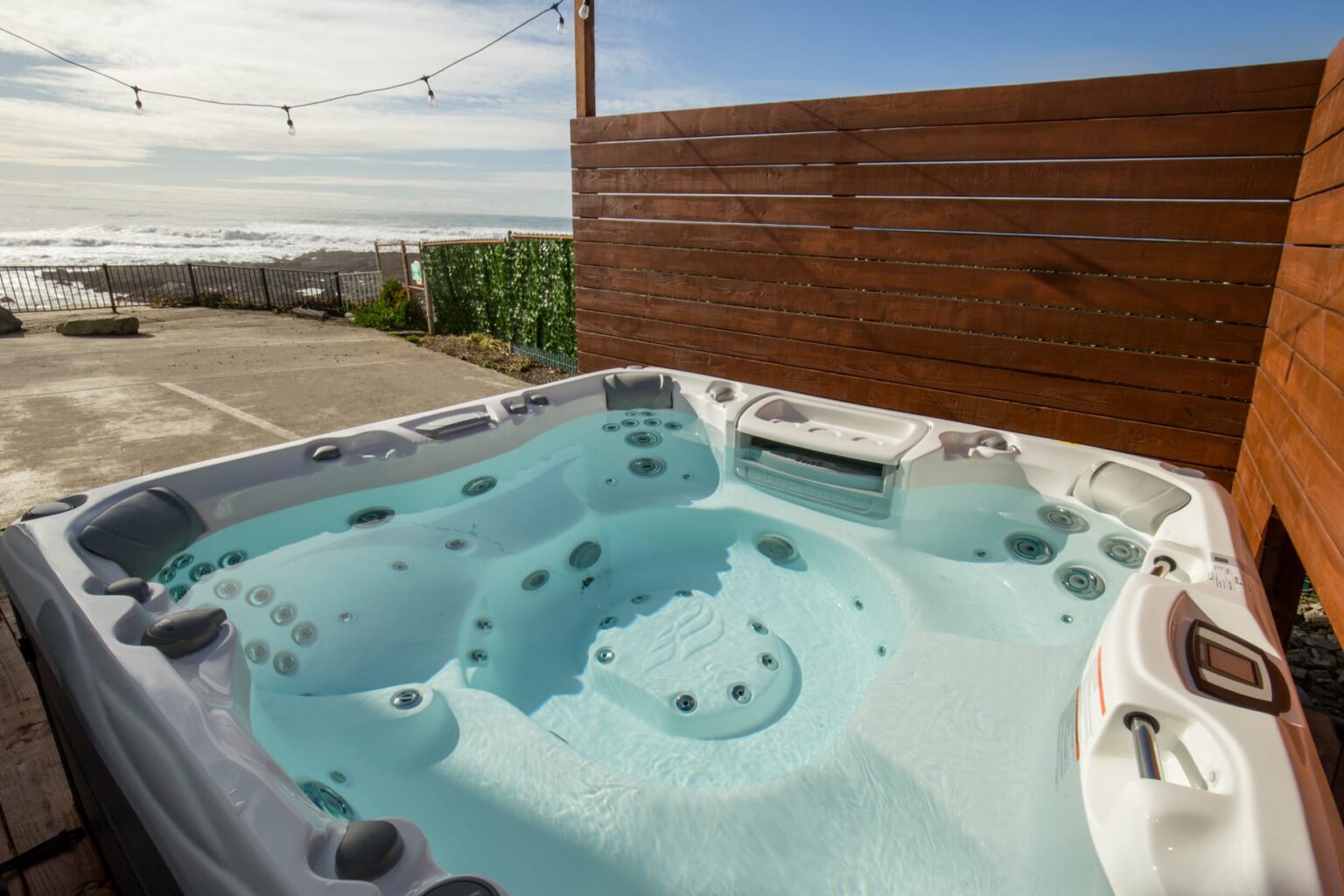 A Hot Tub on a Wooden Deck with a View of the Ocean Waves in Shelter Cove, CA