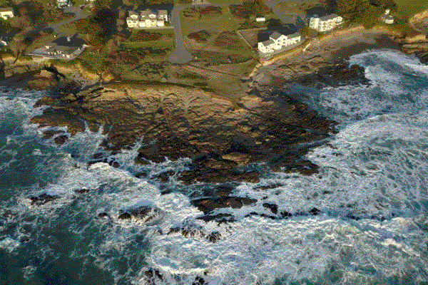 Oceanfront house with a serene coastal view captured from above in Redwood